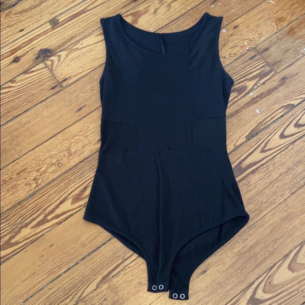 Body suit with mesh cut outs